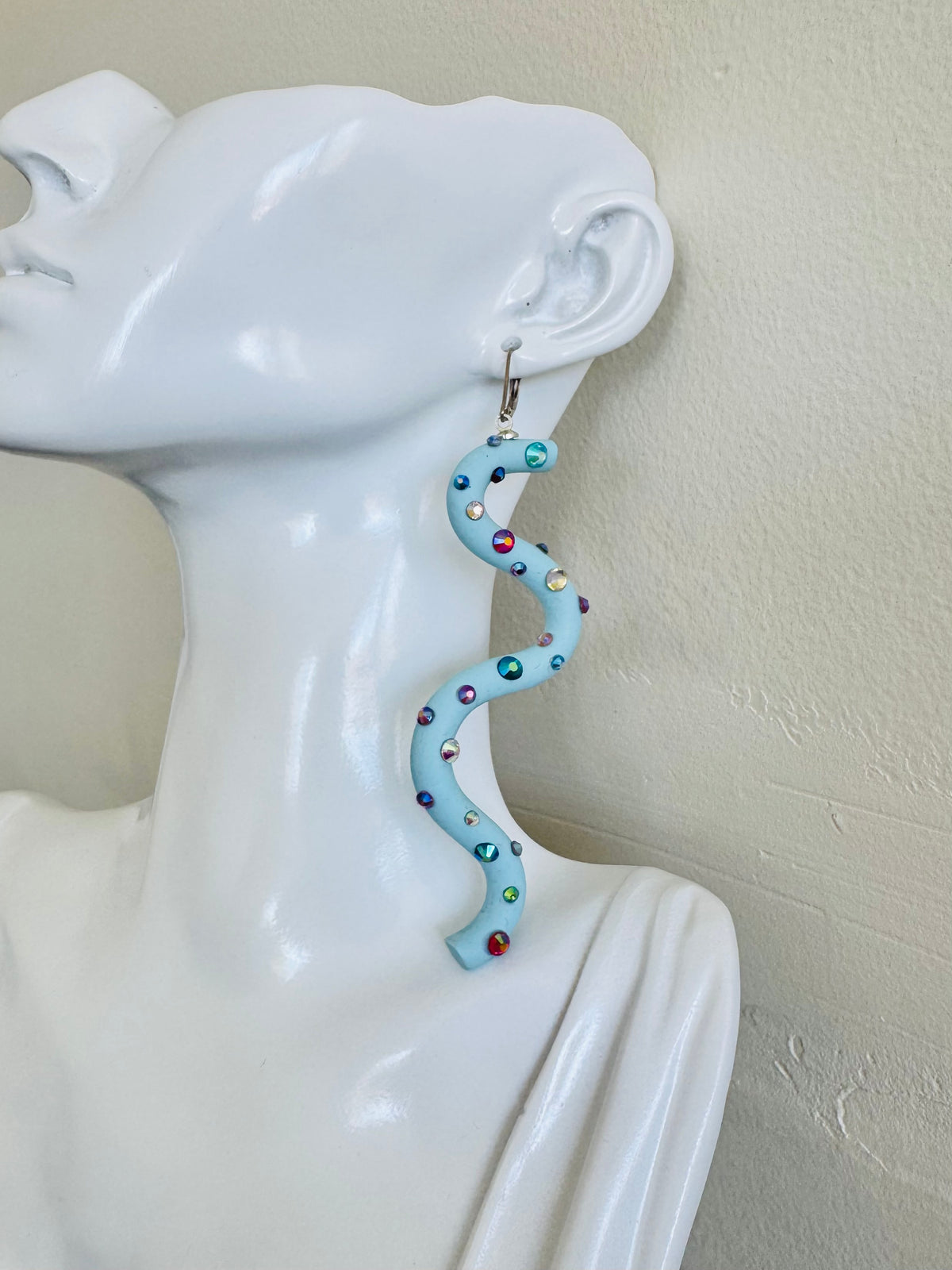Pastel blue squiggle polymer clay earrings with holographic gems