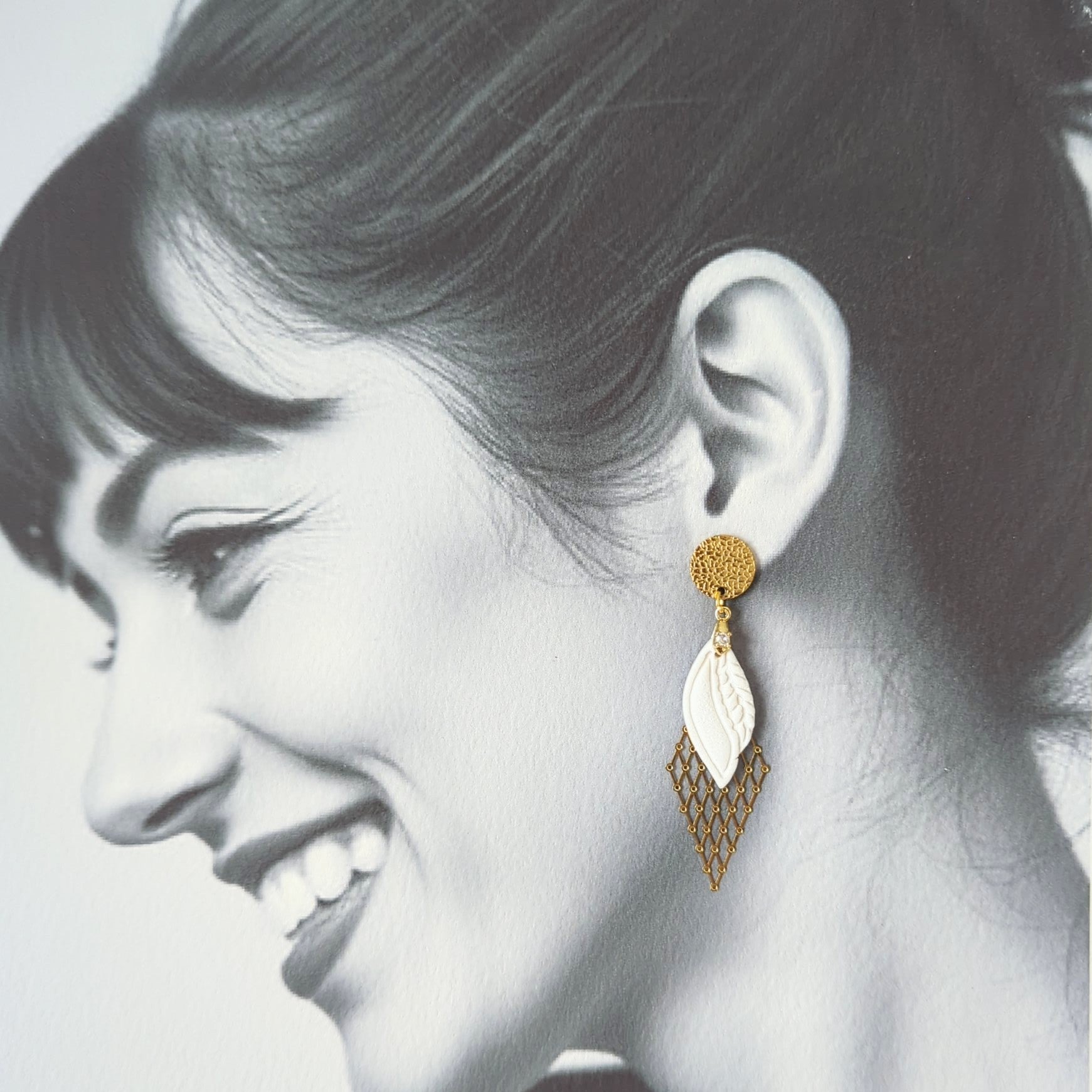 White Earrings With Gold Findings in Different Designs.