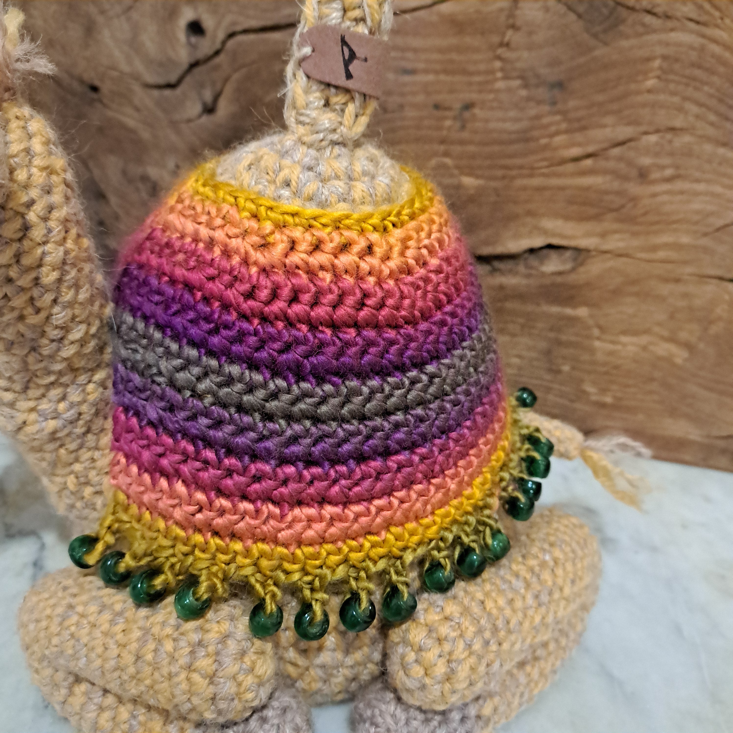 Handmade crochet camel doorstop colourful coat mustard coloured base