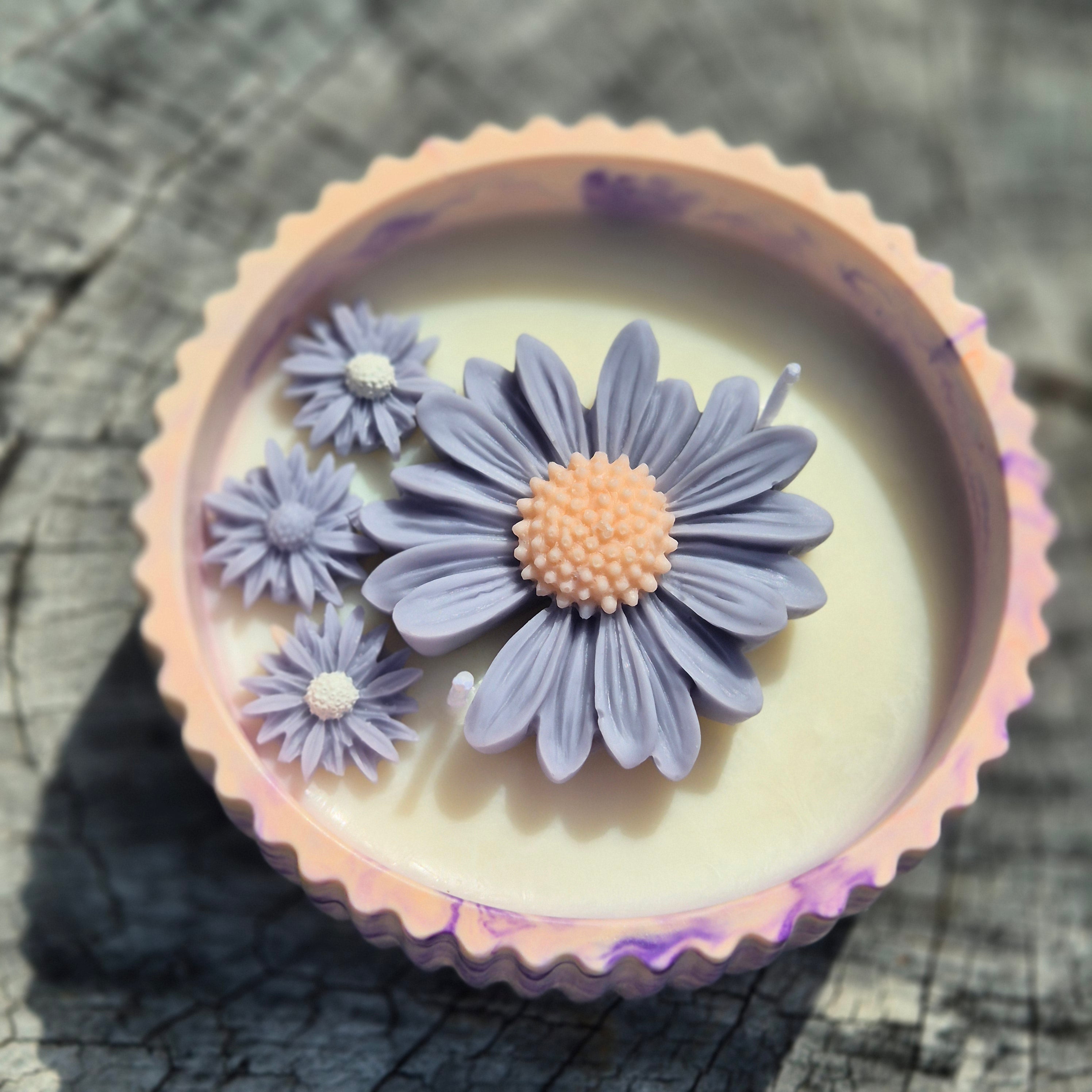 Round orange and purple concrete bowl candle with rose and lavender scent