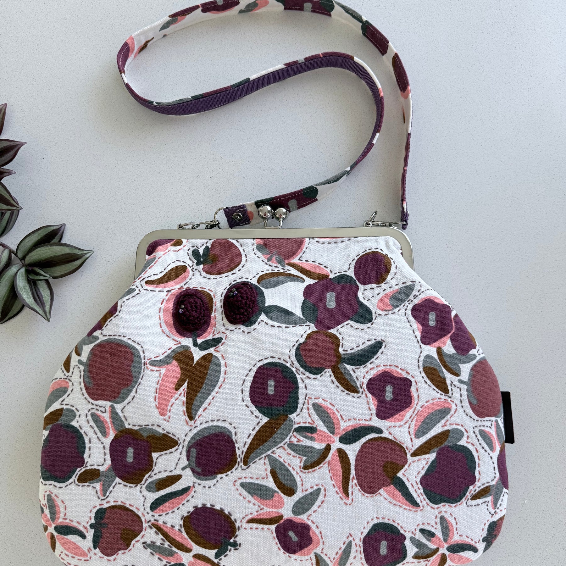 ‘Plum’ metal frame oversized purse