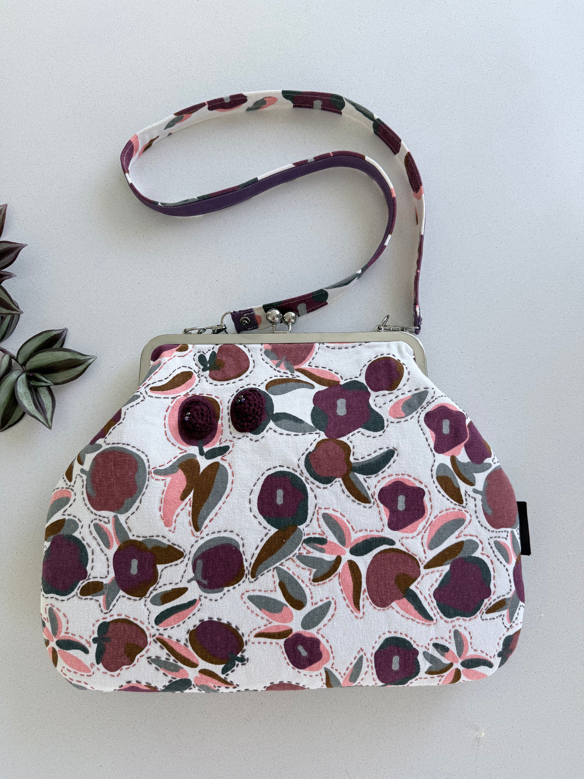 ‘Plum’ metal frame oversized purse