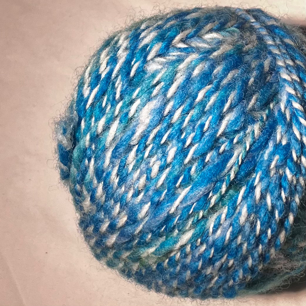 Wool cake in blues and greens