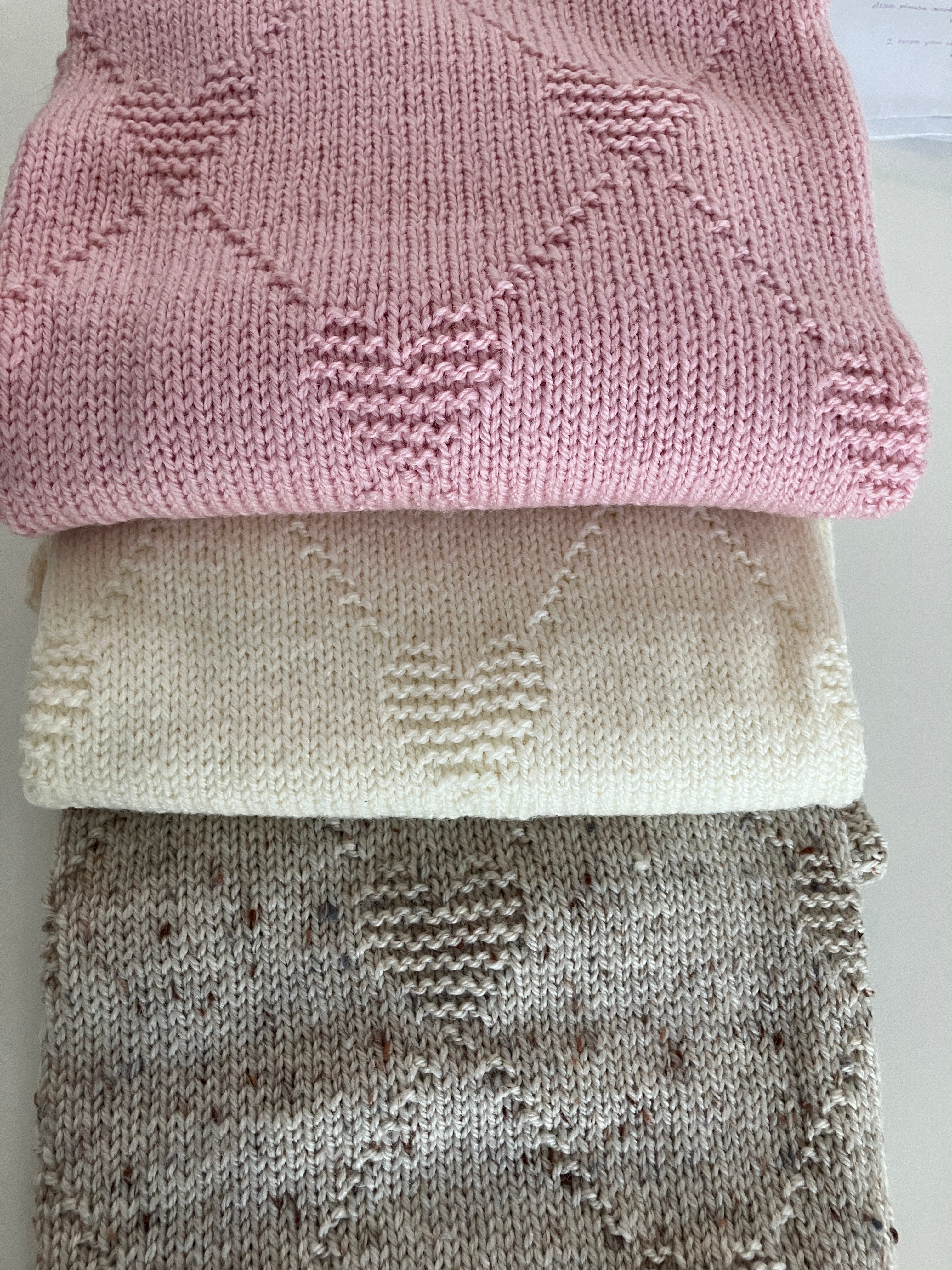 Baby shawl - hugs & kisses design - hand-knitted in Australian wool - 3 colours