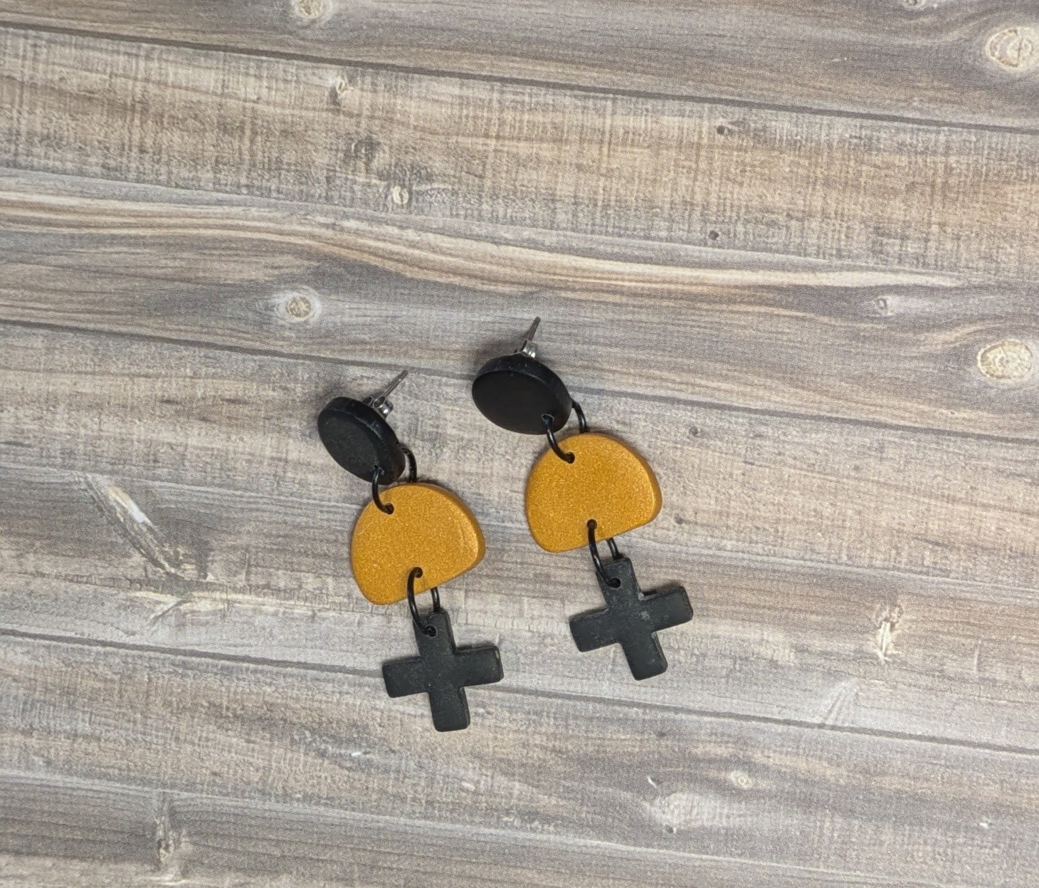 Black cross drop earrings