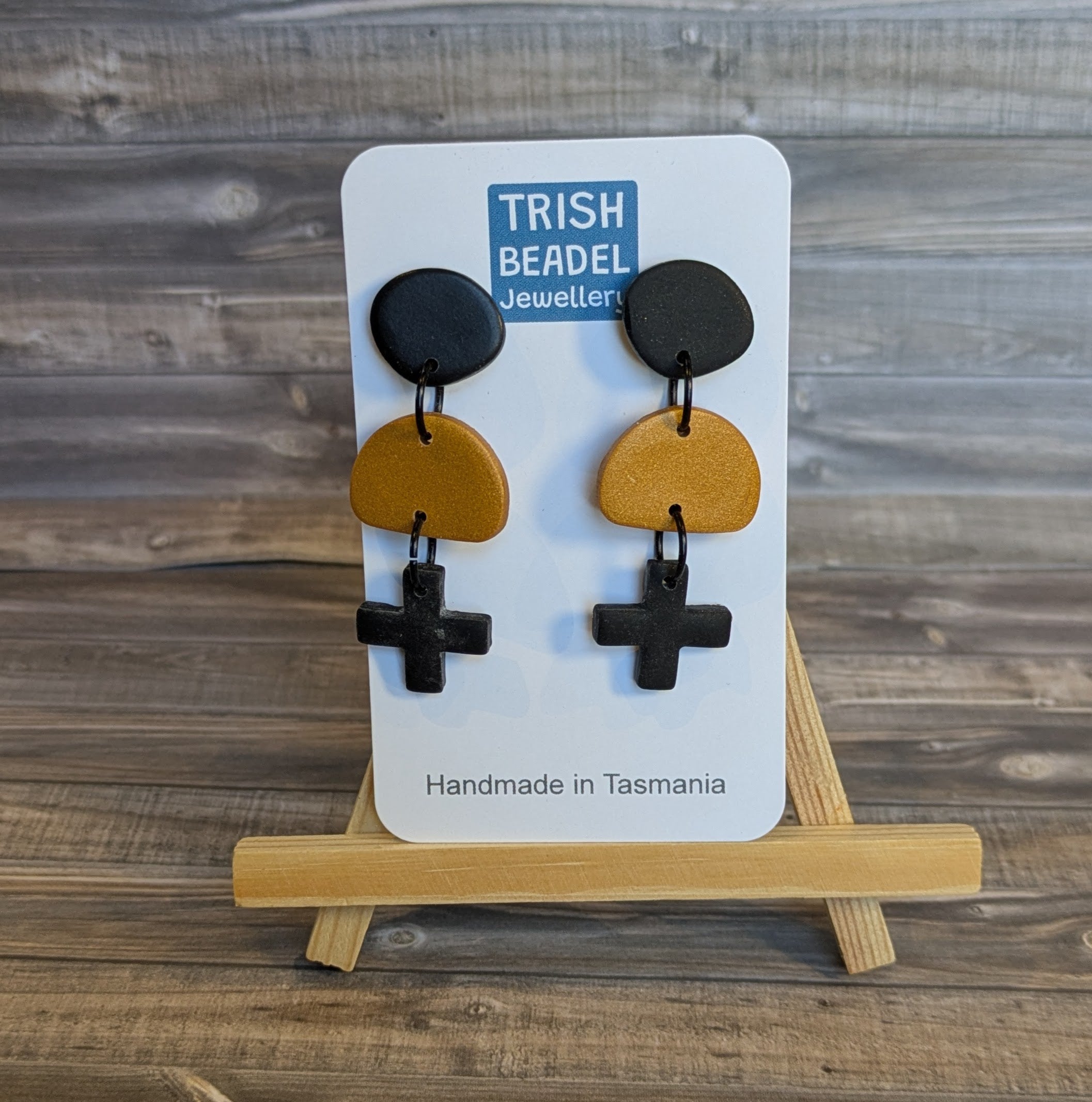Black cross drop earrings