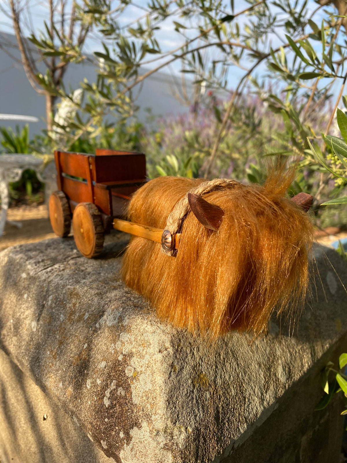 Handmade wooden cow and wagon