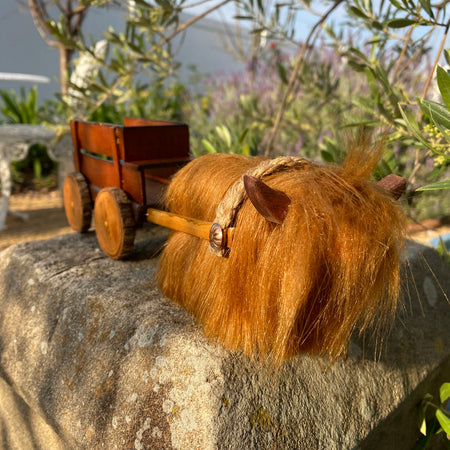 Handmade wooden cow and wagon