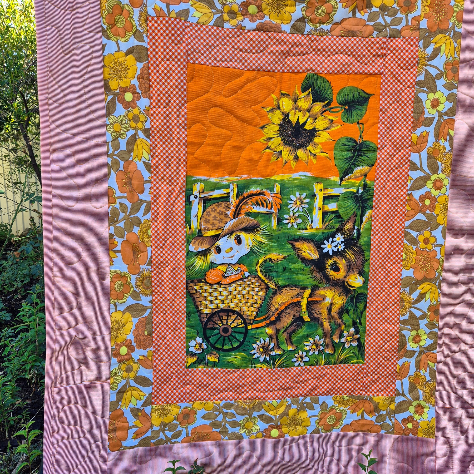 Sunflowers and daisies, girl cot sized quilt