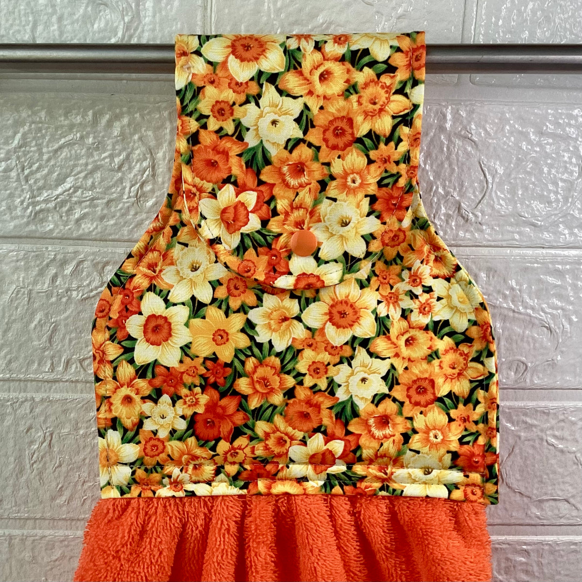 Daffodils (orange) hanging hand towel.