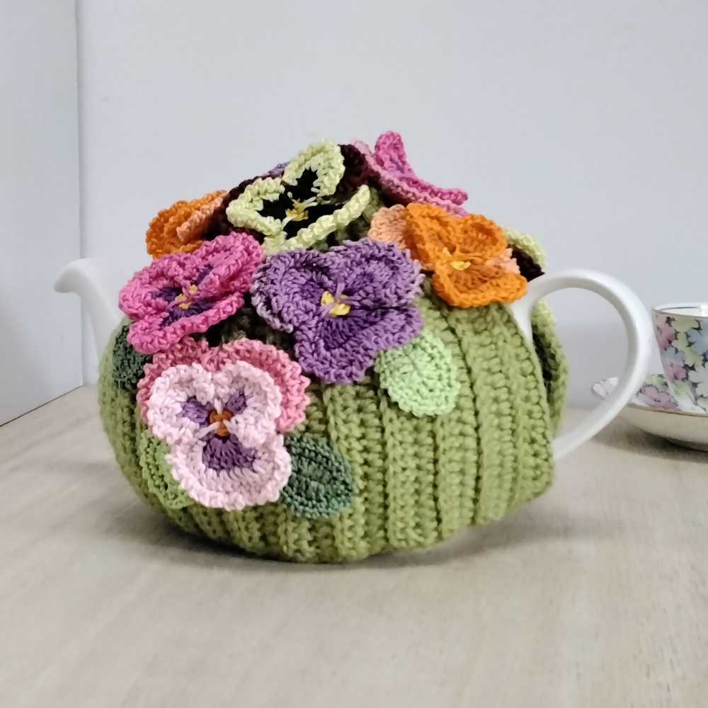 Pansy-garden-teacosy-white-oval-teapot-left-Australian-made-watch-the-birdy-crochet