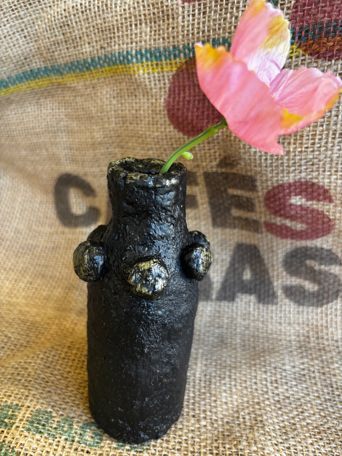 Small black and gold vase