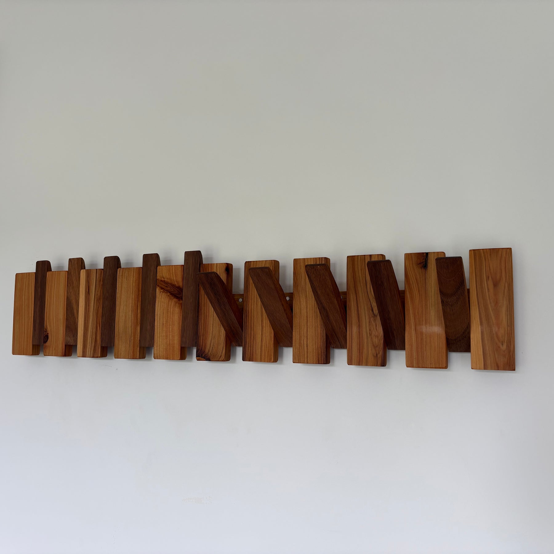 Two tone piano style coatrack