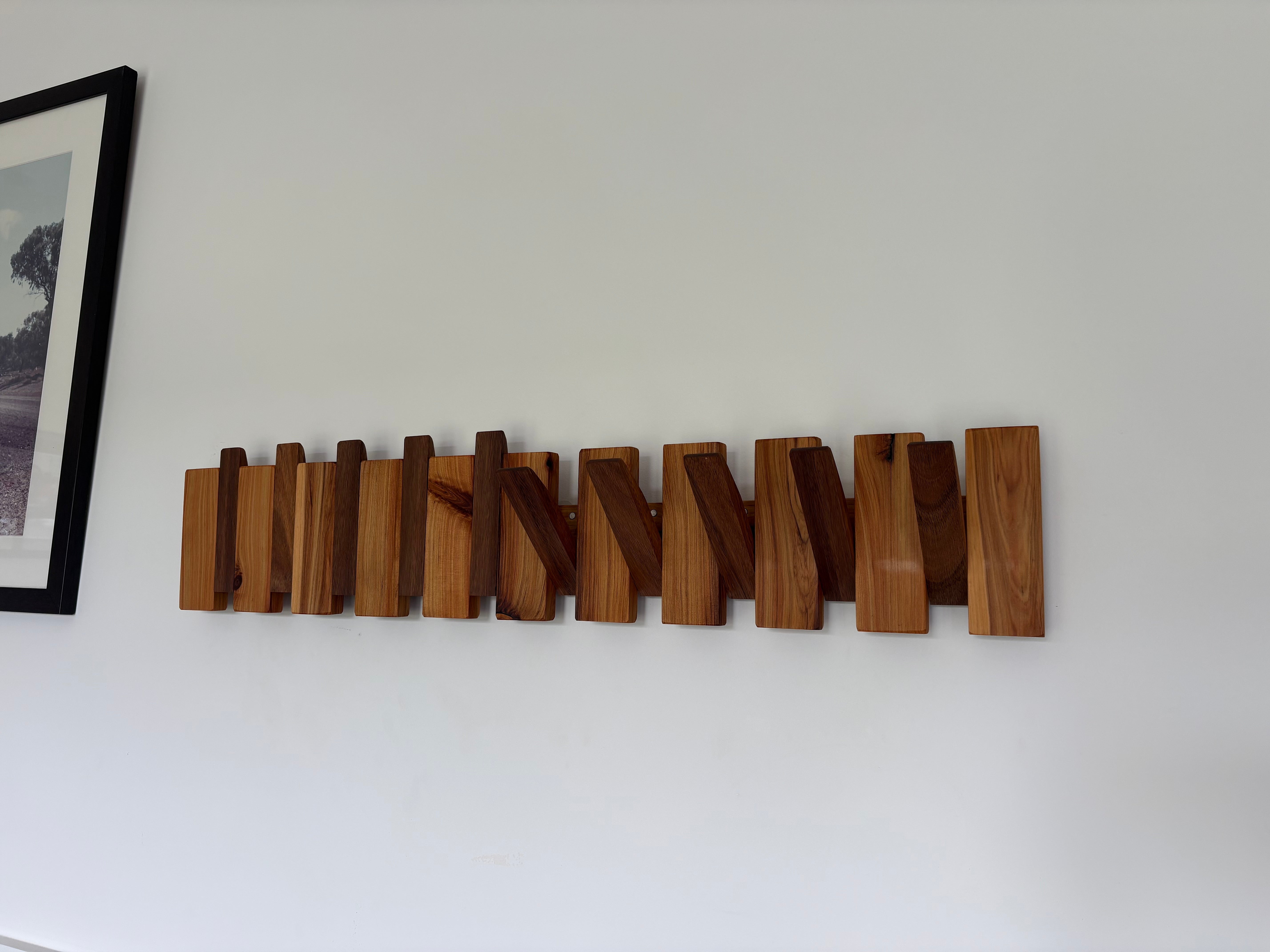 Two tone piano style coatrack