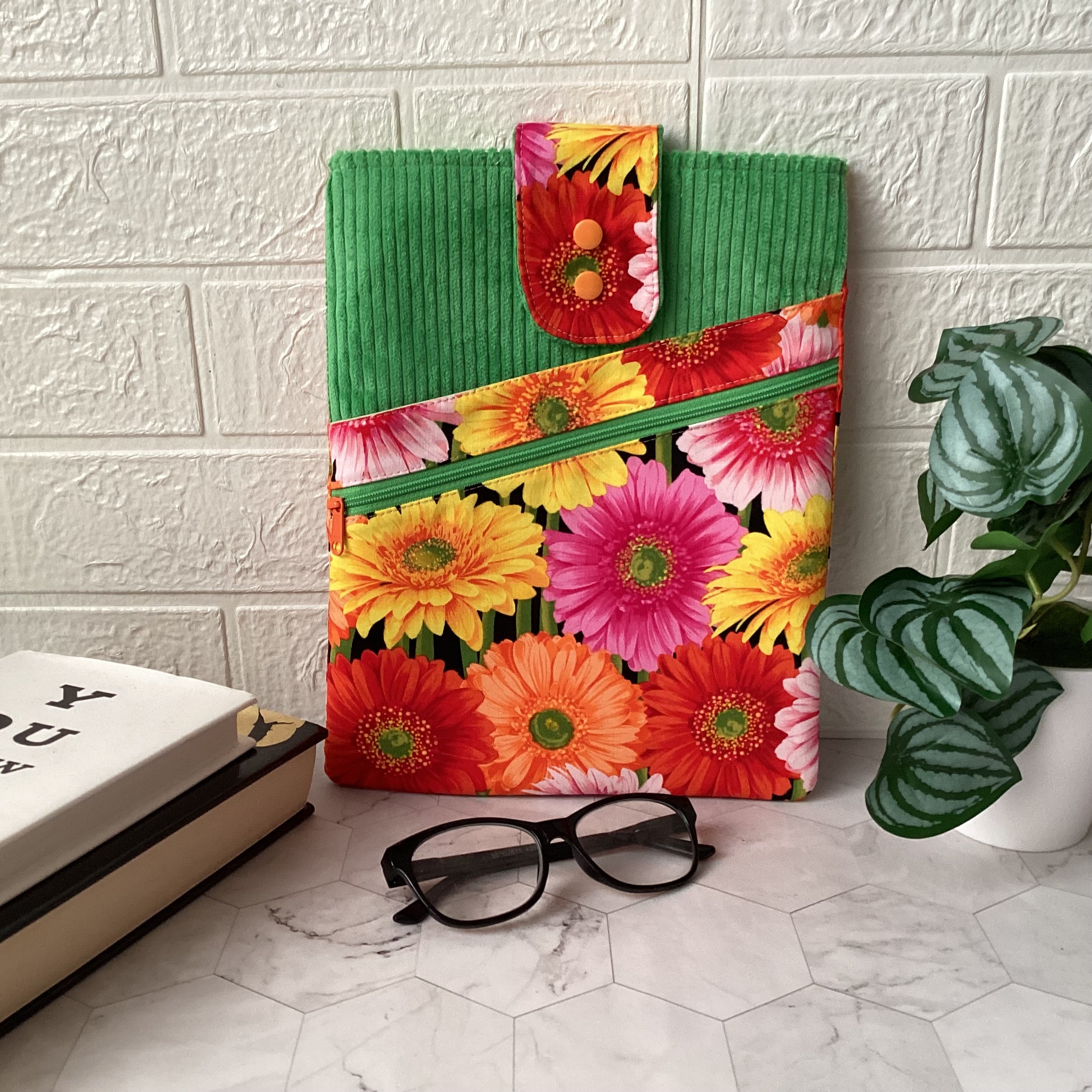 Colourful daisies book sleeve with 2 pockets. iPad, tablet pouch