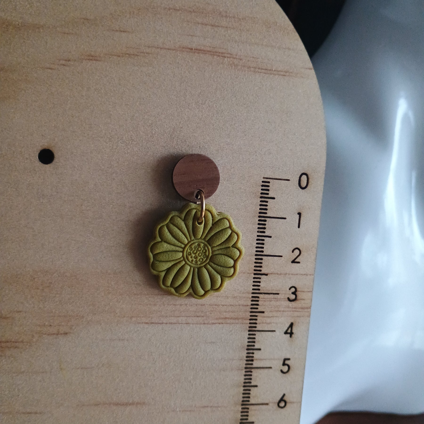 Earthy embossed flower earrings with natural wood stud