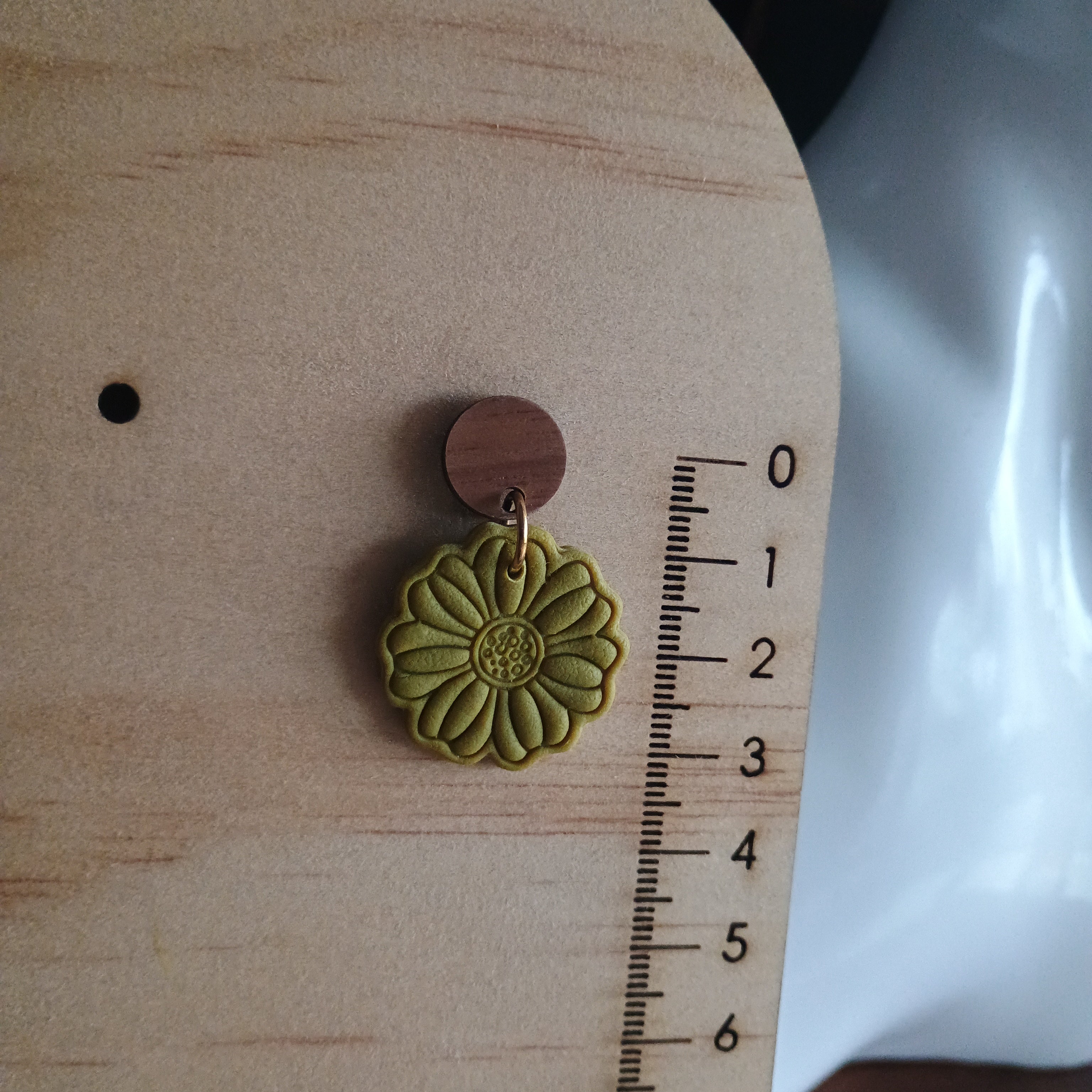Earthy embossed flower earrings with natural wood stud