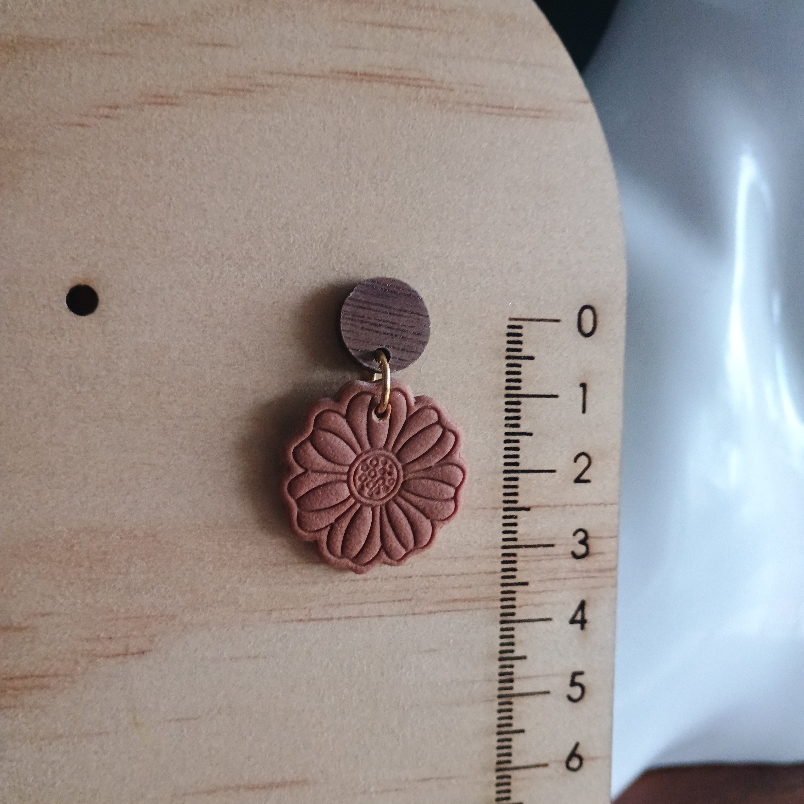 Earthy embossed flower earrings with natural wood stud