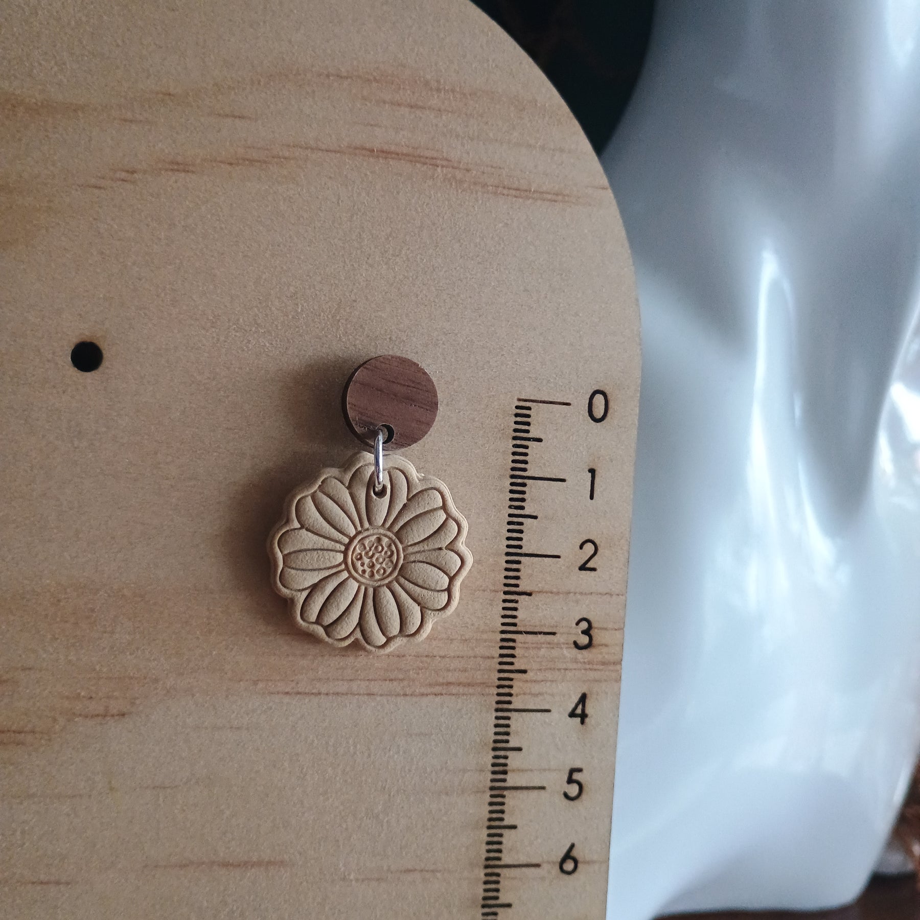 Earthy embossed flower earrings with natural wood stud
