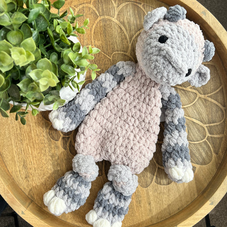Handmade crochet modern Yeti lovey snuggler with knotted legs.