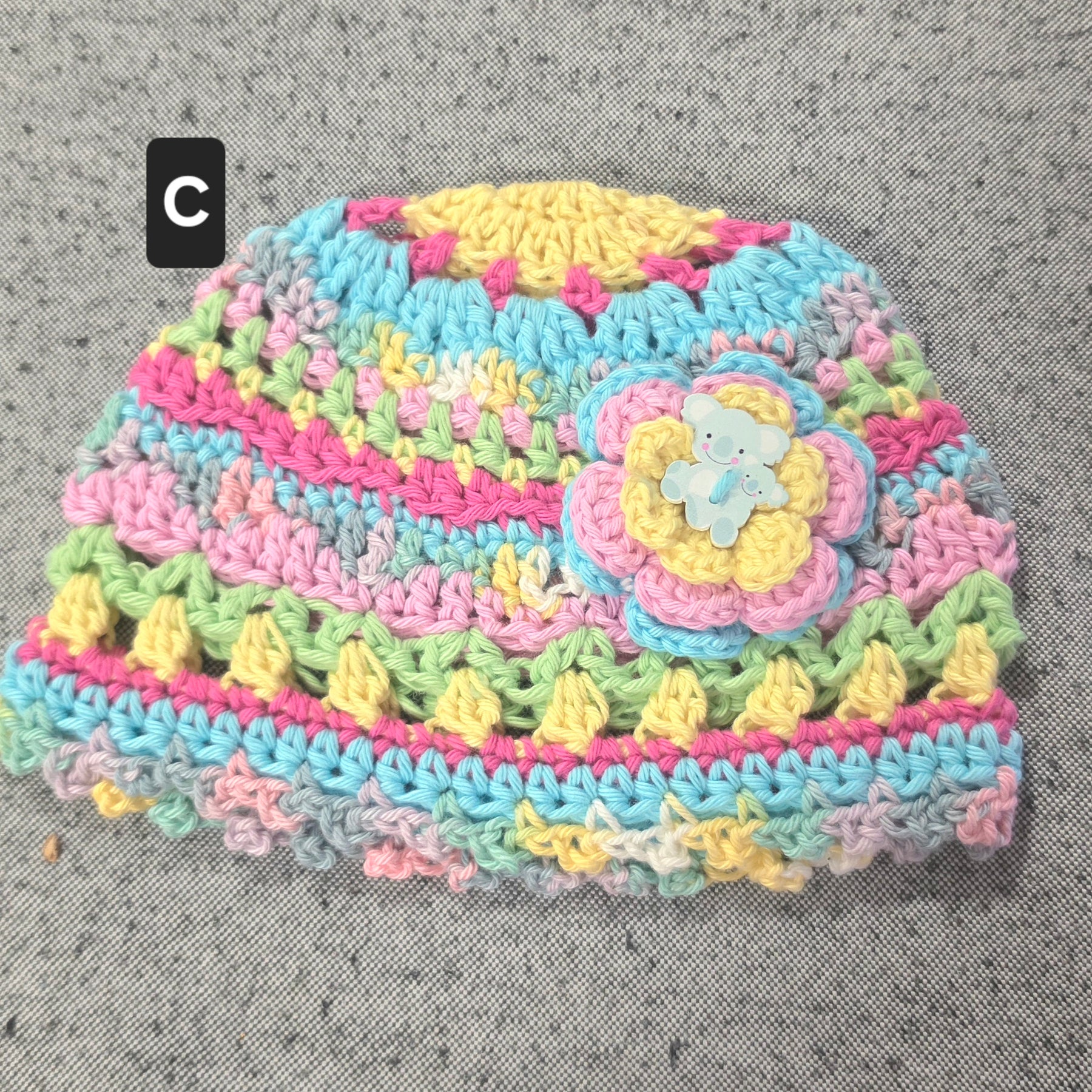 Crocheted Baby Hat with Flower Detail