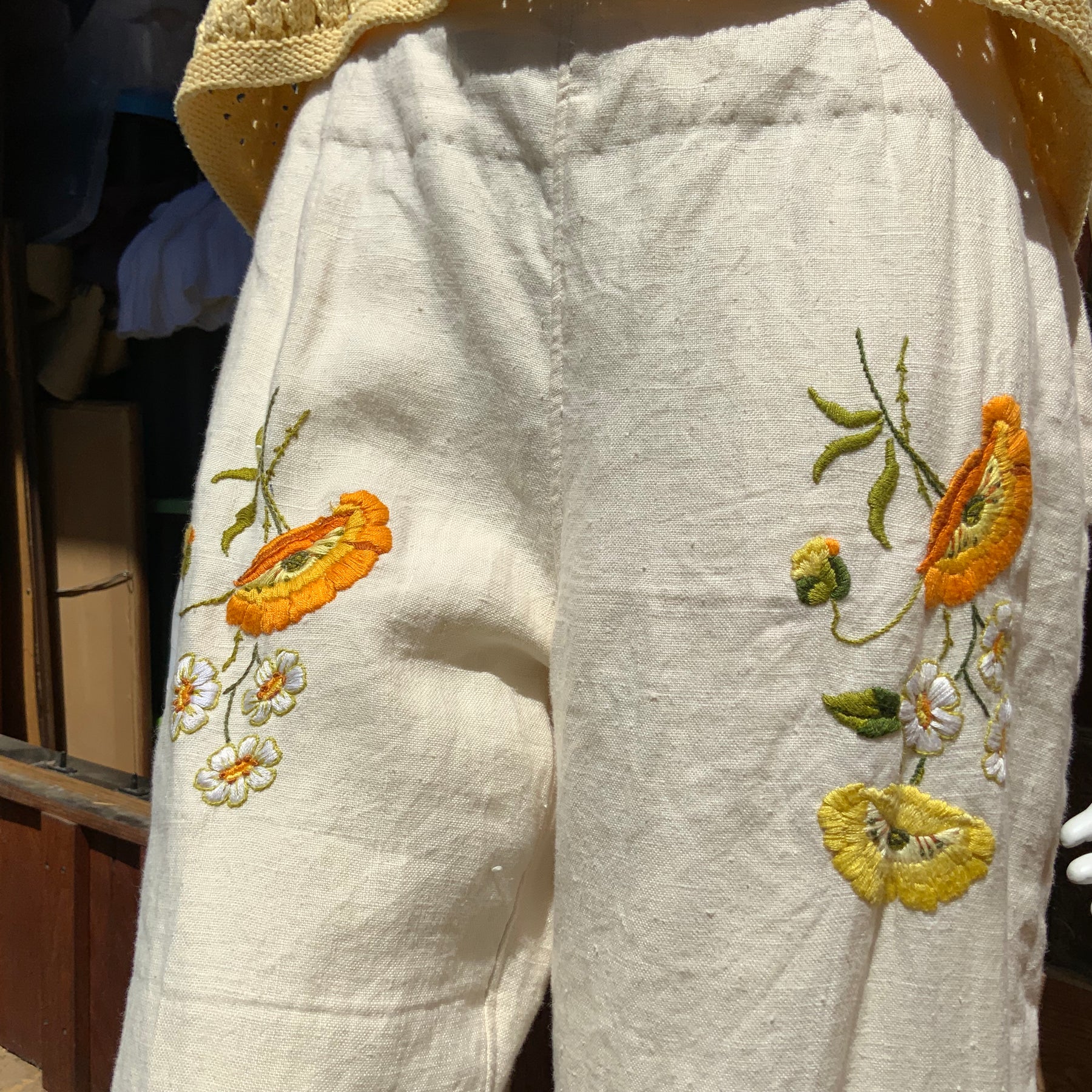 Upcycled embroidered linen tablecloth into "Flower Power" Bell Bottoms