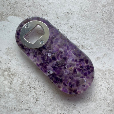 Resin bottle opener with inlaid semi-precious amethyst stones