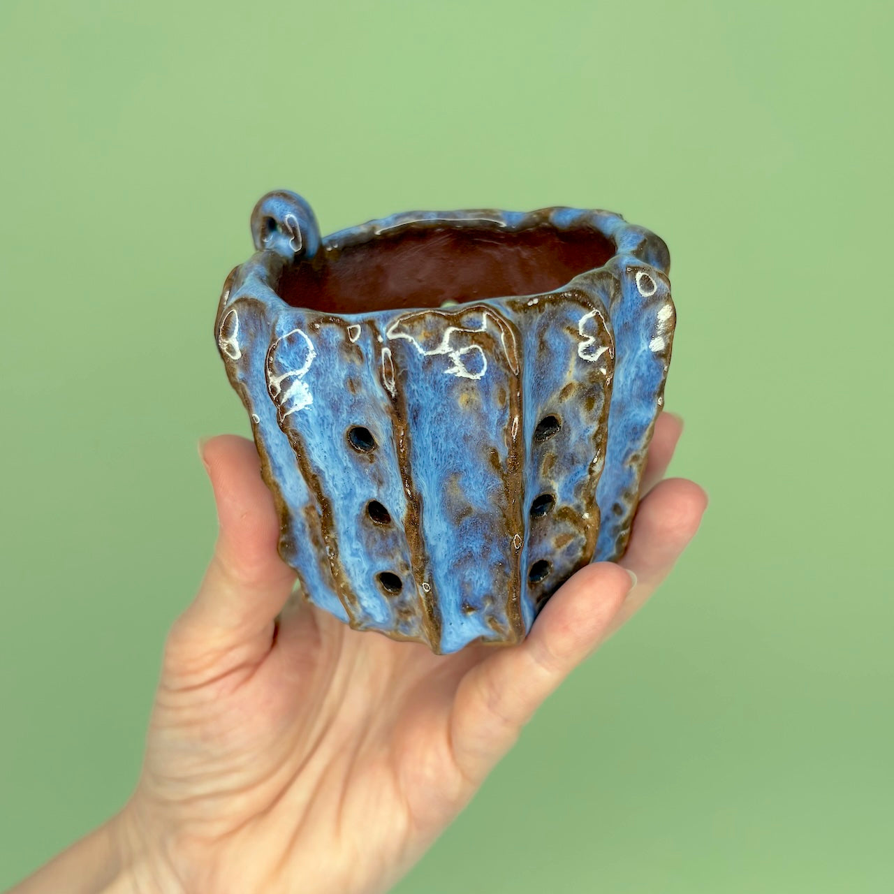 Ceramic orchid pot with vertical ridges