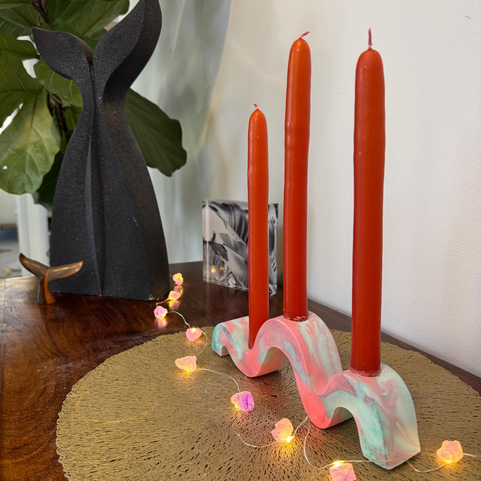 Red and green and gold wavy concrete holder for taper candles