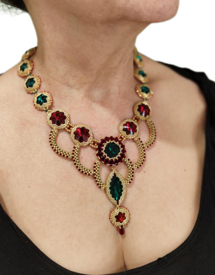 Bead-woven statement necklace with red/green crystal accents