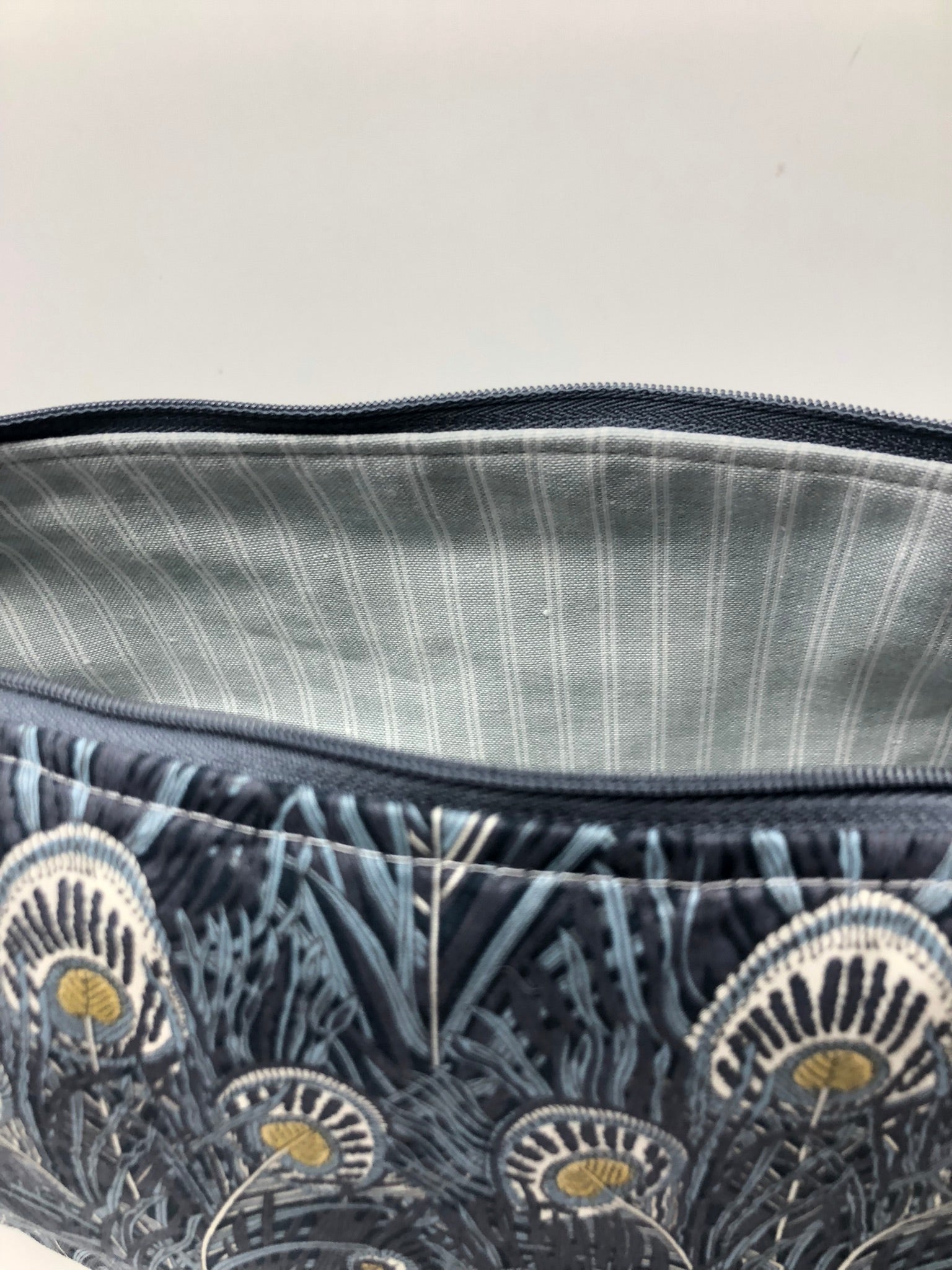 Liberty fabric Hera design - fully lined with grey stripe ticking.  Inner zipper pocket