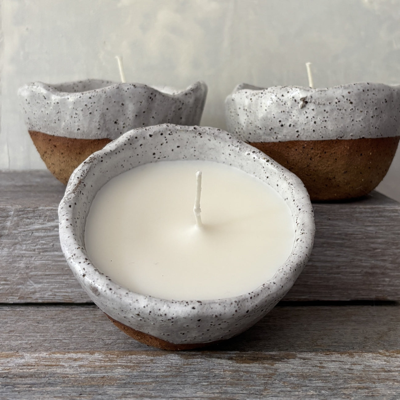 Soy candle in rustic white speckled ceramic bowl