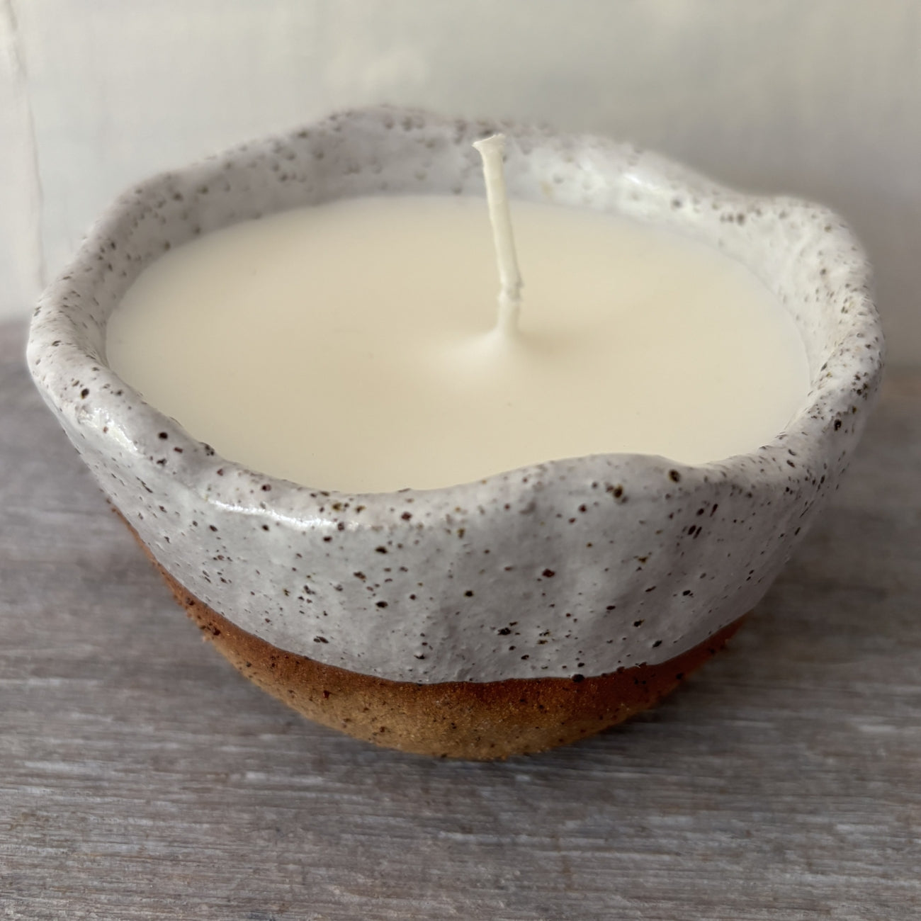 Soy candle in rustic white speckled ceramic bowl