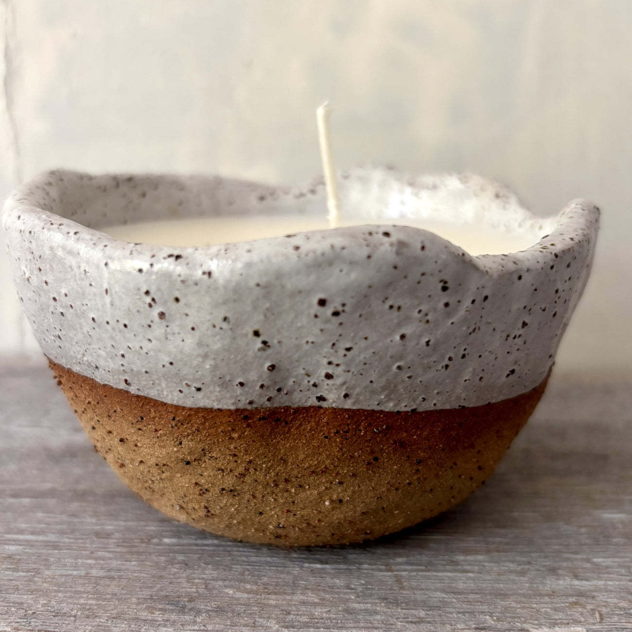 Soy candle in rustic white speckled ceramic bowl