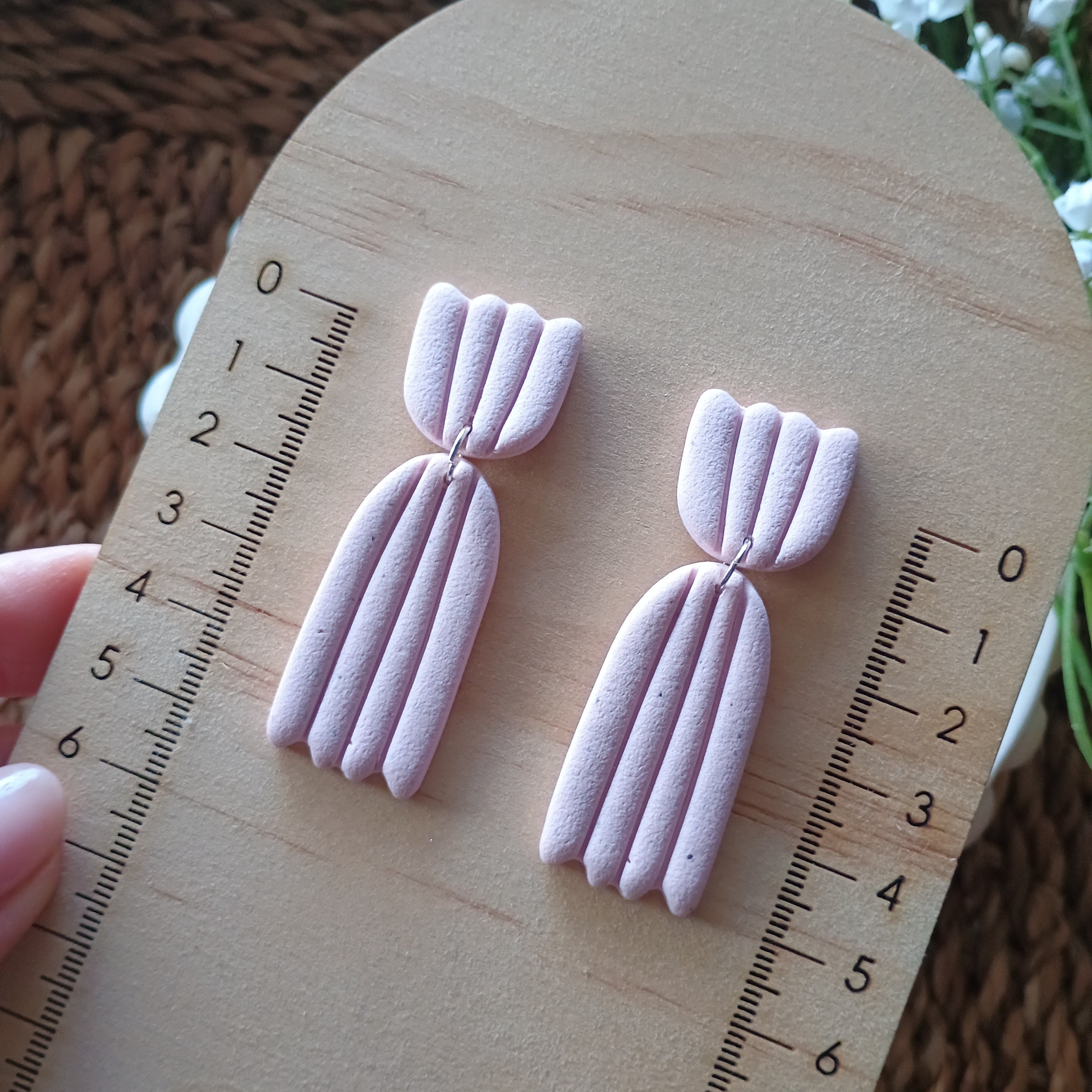 Embossed petal dangle earrings