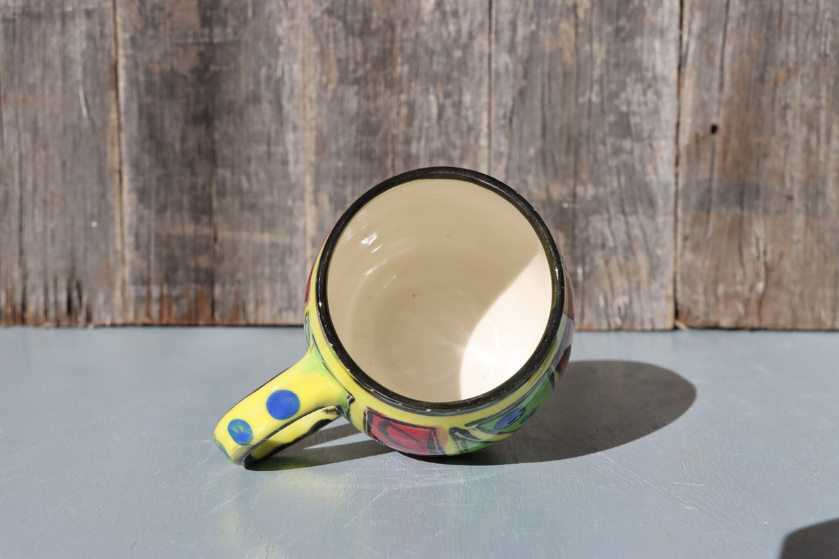 Hand-Painted Mug: Abstract yellow, red, green, black and blue mid-fire stoneware