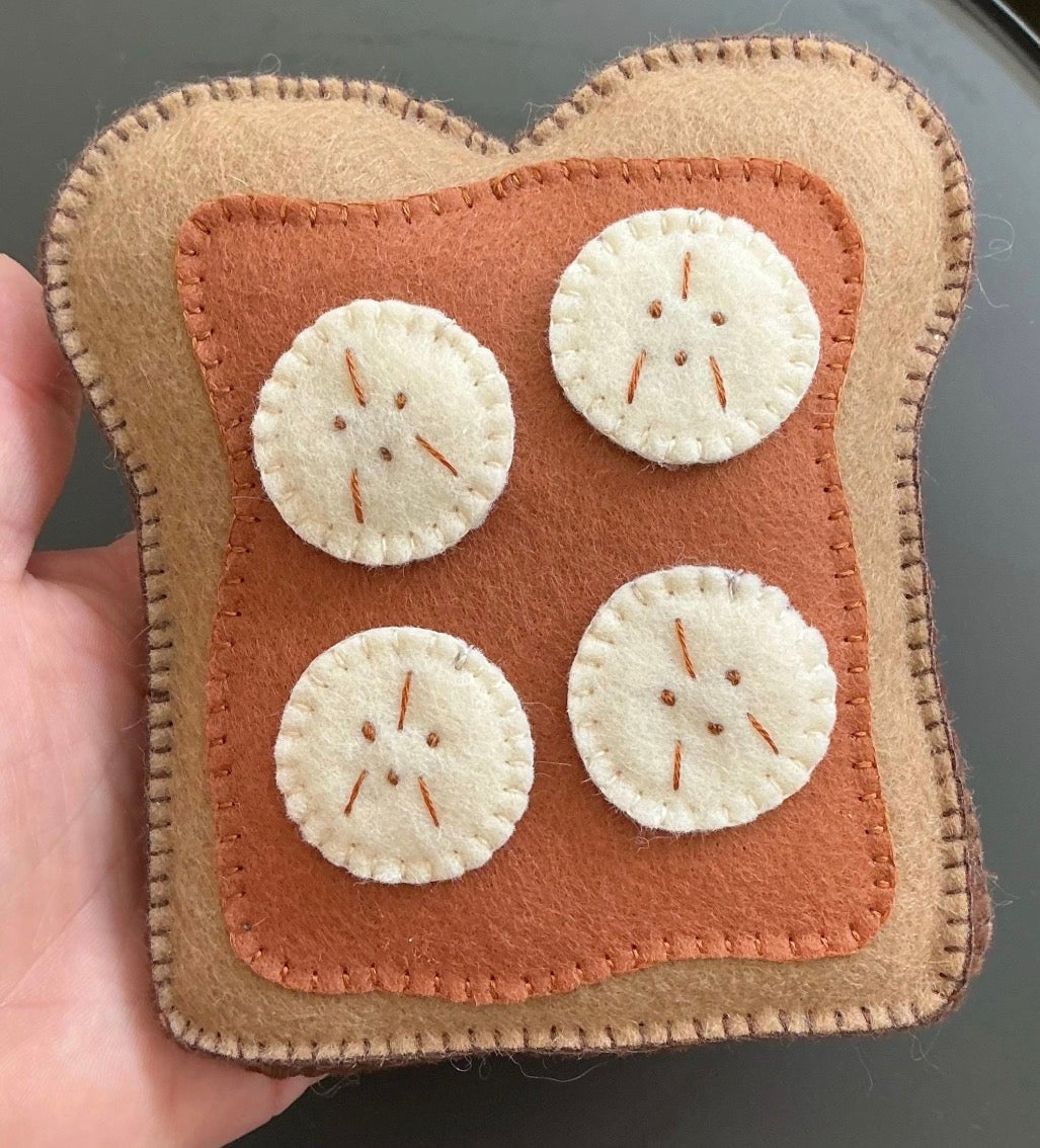Felt peanut butter on toast with banana slices