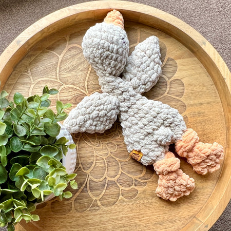 Handmade crochet Mini Goose modern lovey with knotted legs.