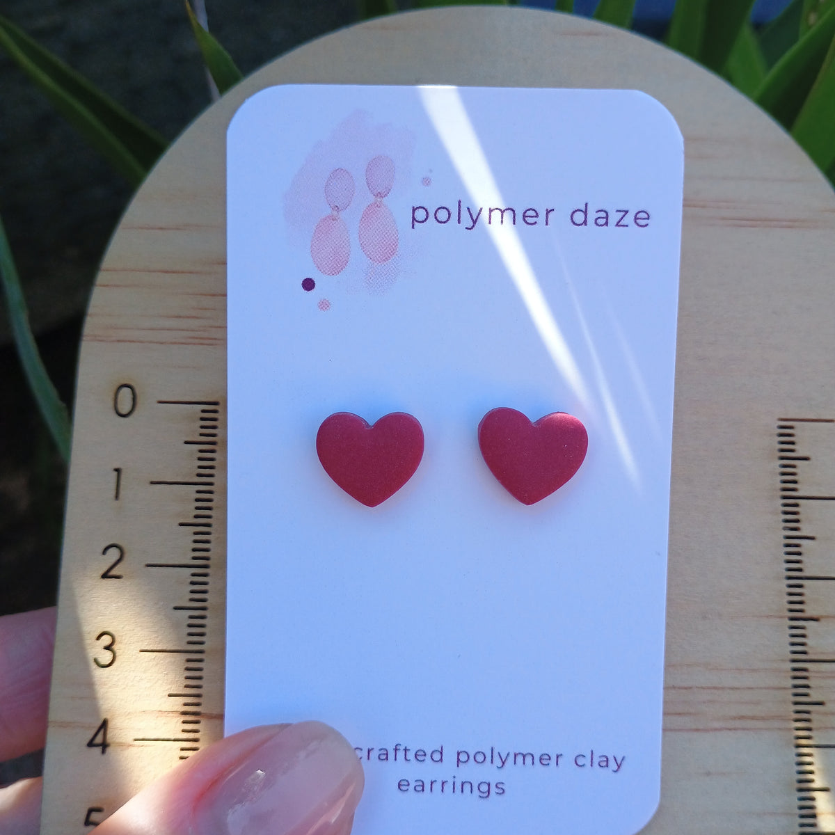 Burgundy hearts stud earrings