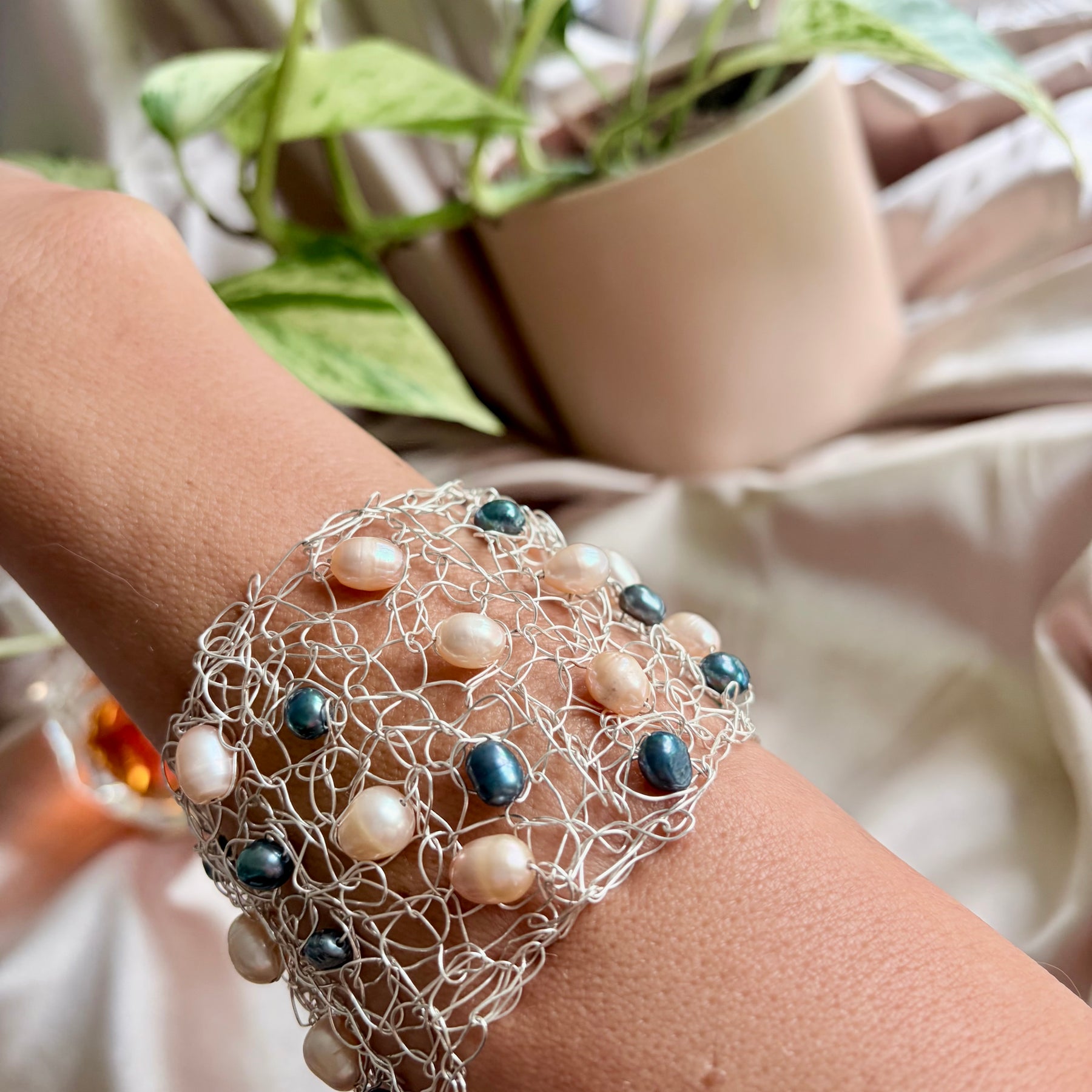 “Pearls Dance” — Peach and dark blue pearls cuff