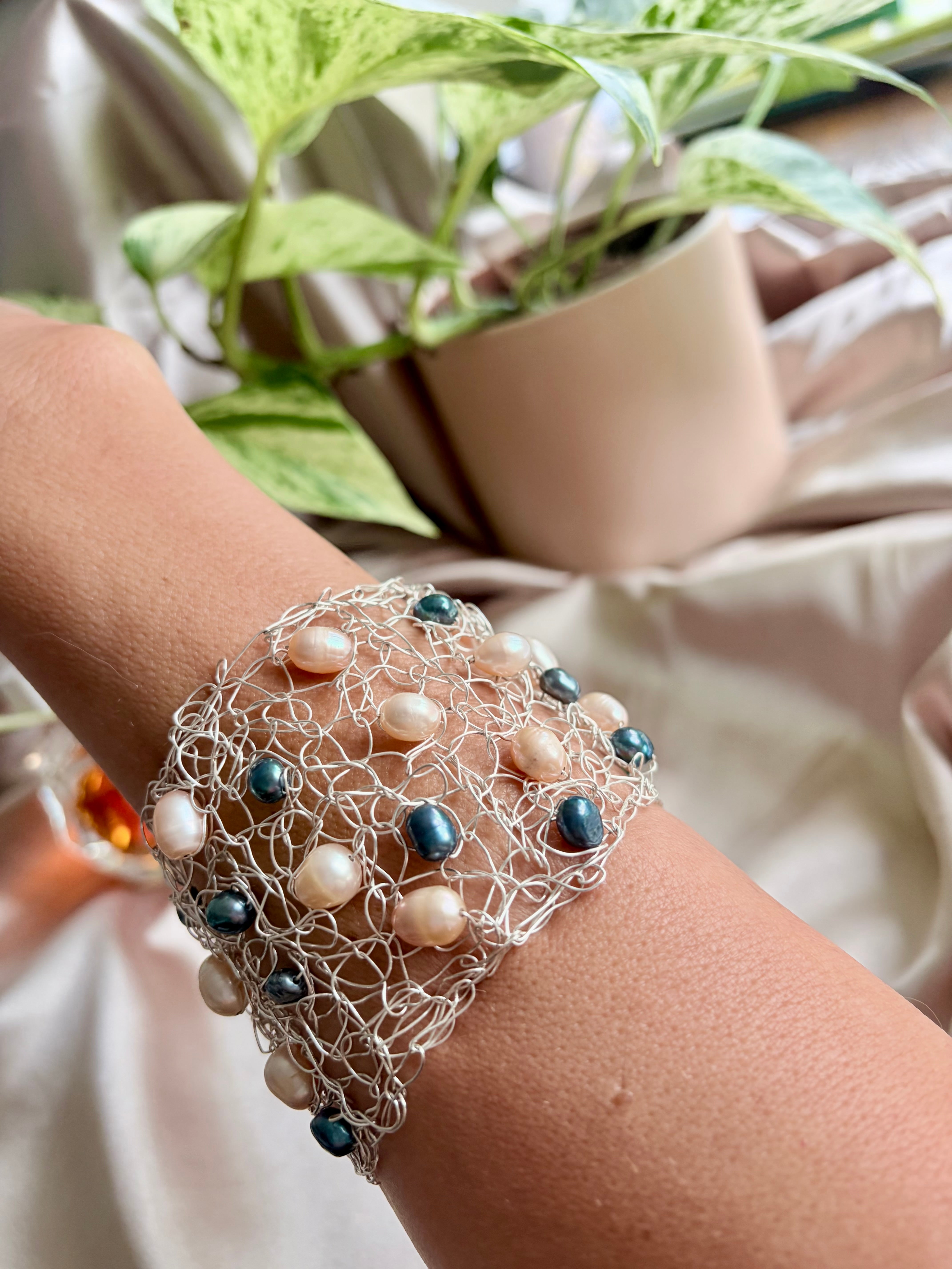 “Pearls Dance” — Peach and dark blue pearls cuff