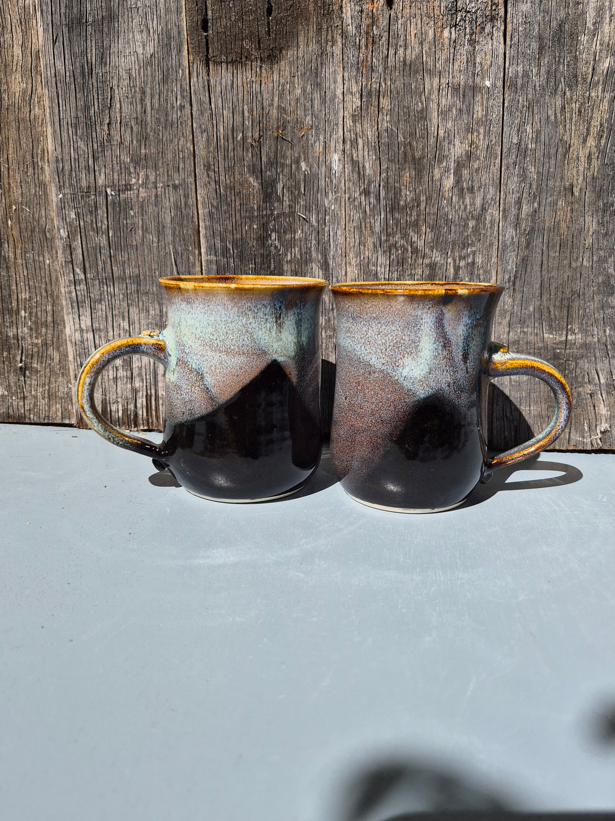 Large hand made mugs in speckled brown and white