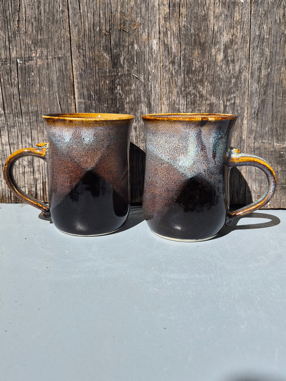 Large hand made mugs in speckled brown and white
