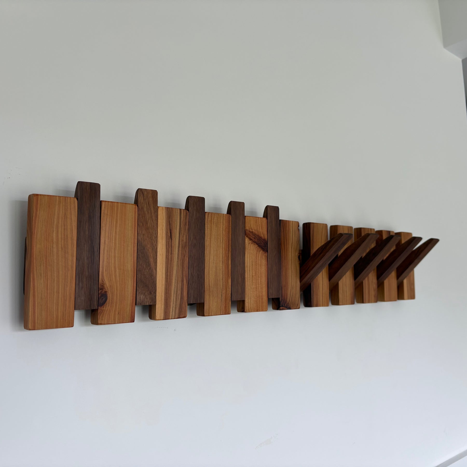 Two tone piano style coatrack