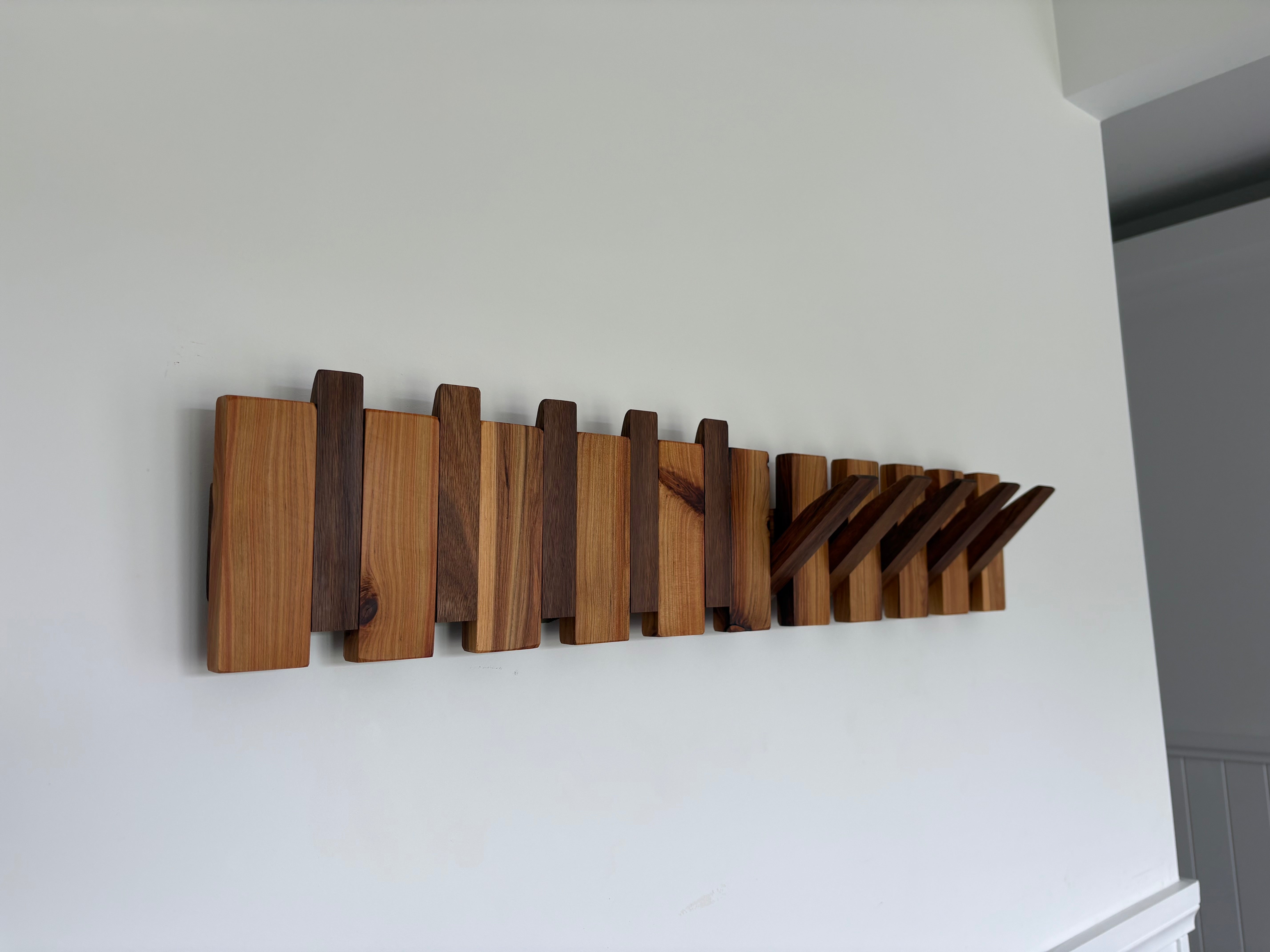 Two tone piano style coatrack
