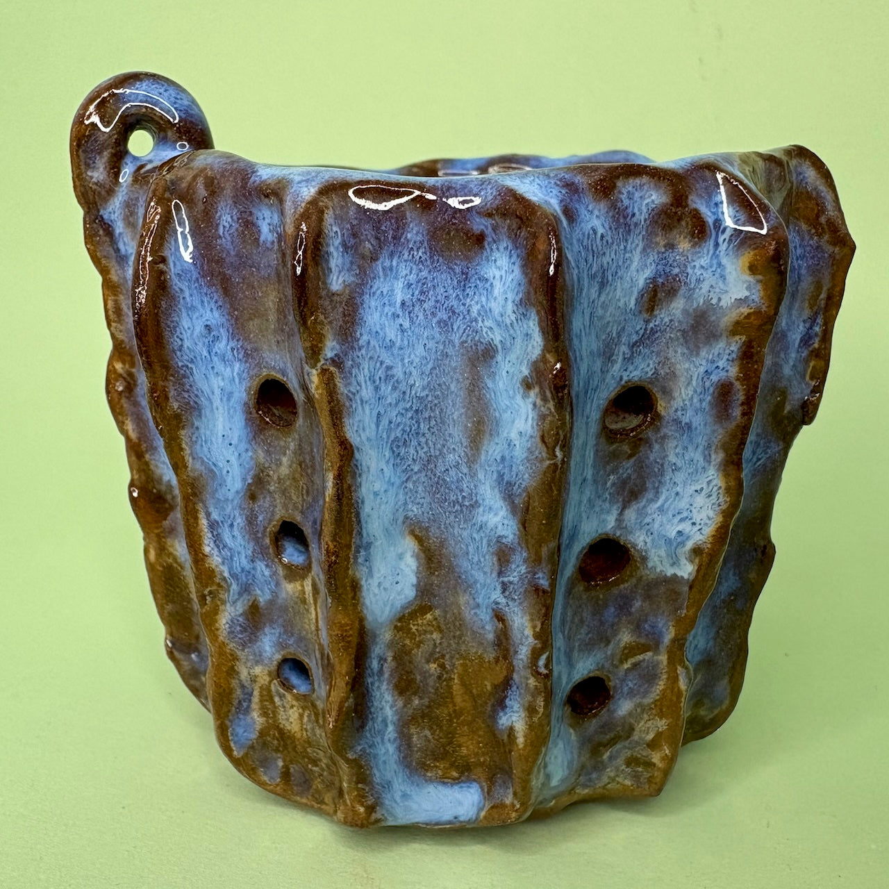 Ceramic orchid pot with vertical ridges