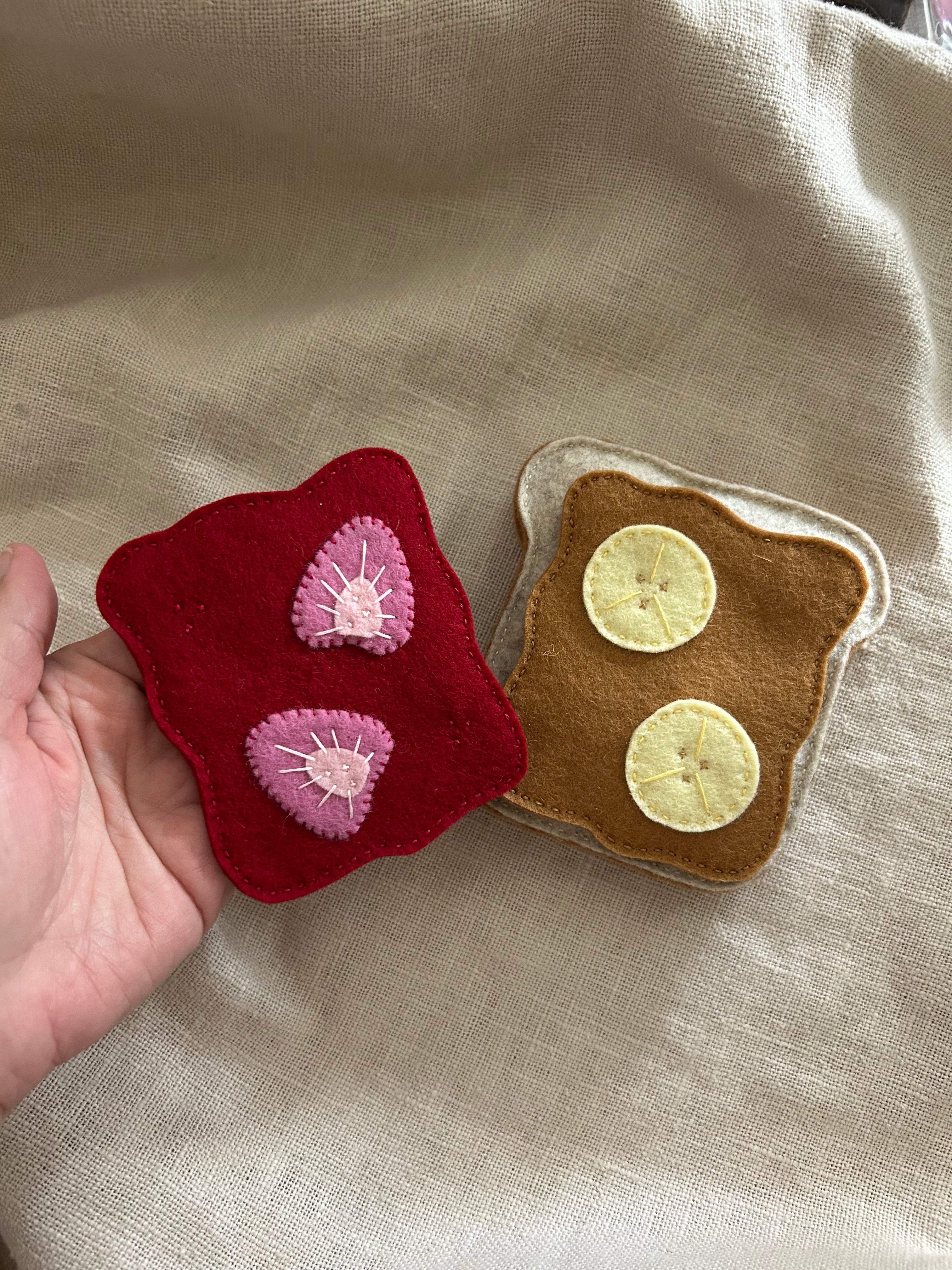 Toast with peanut butter or jam, strawberry jelly, play kitchen