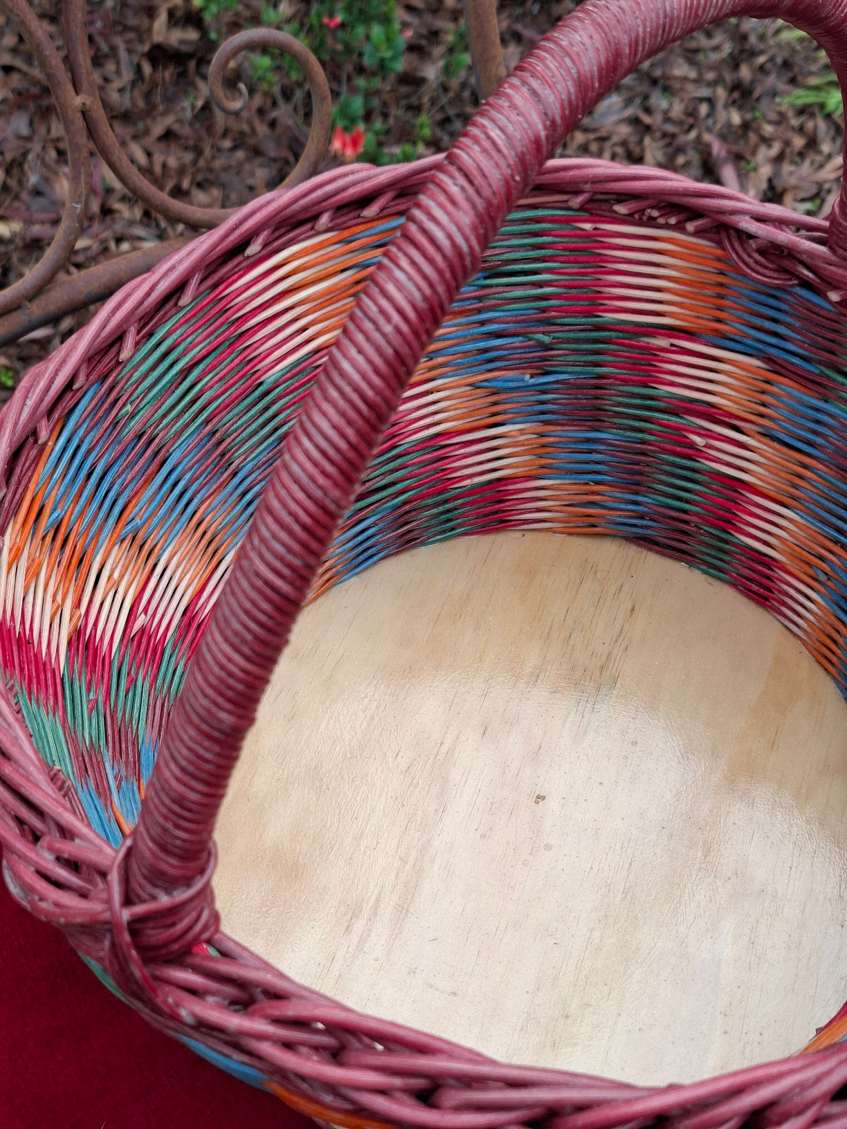 Large Round Market Basket brown, blue, orange, red and natural. Handle brown.