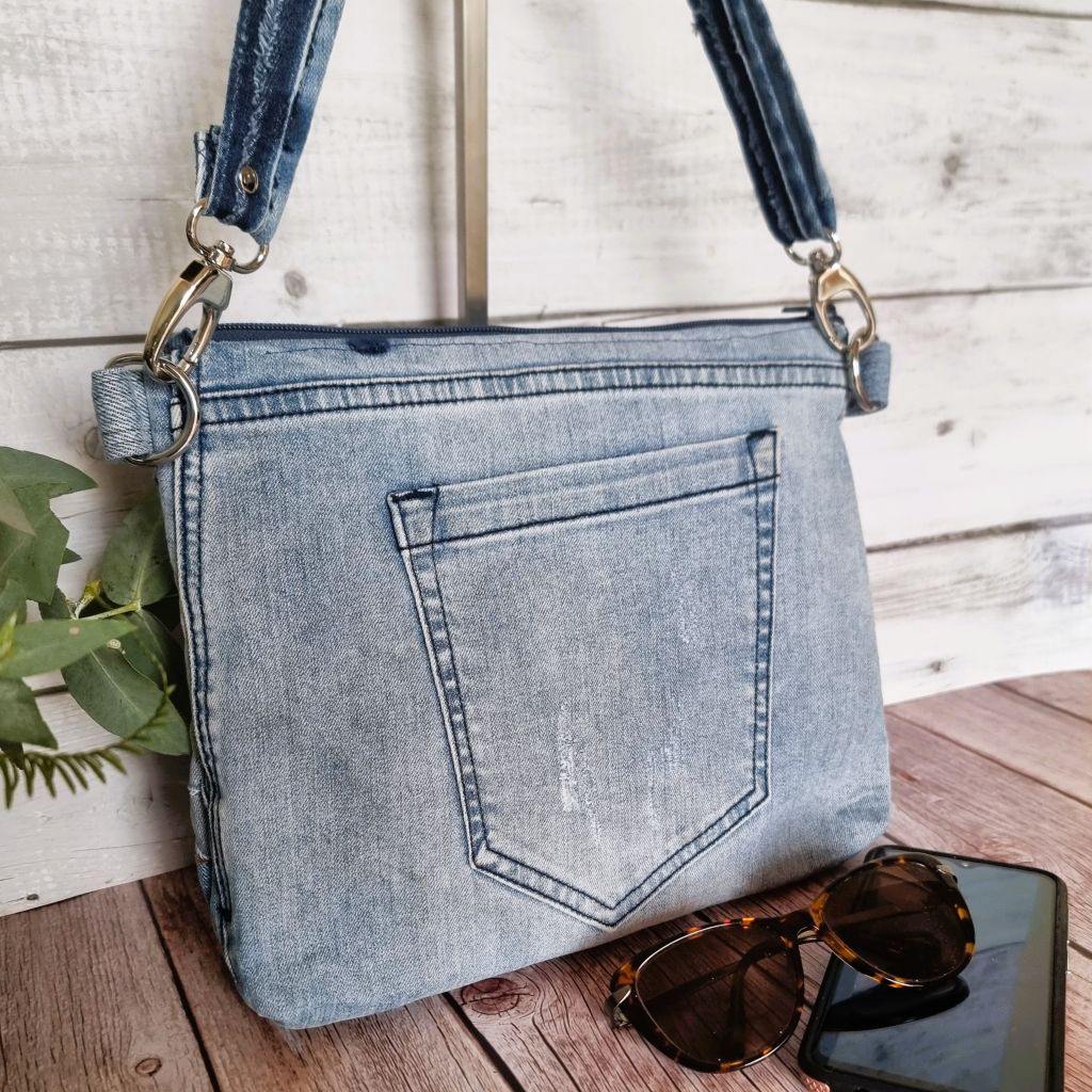 Handmade upcycled angle patched denim zip crossbody bag