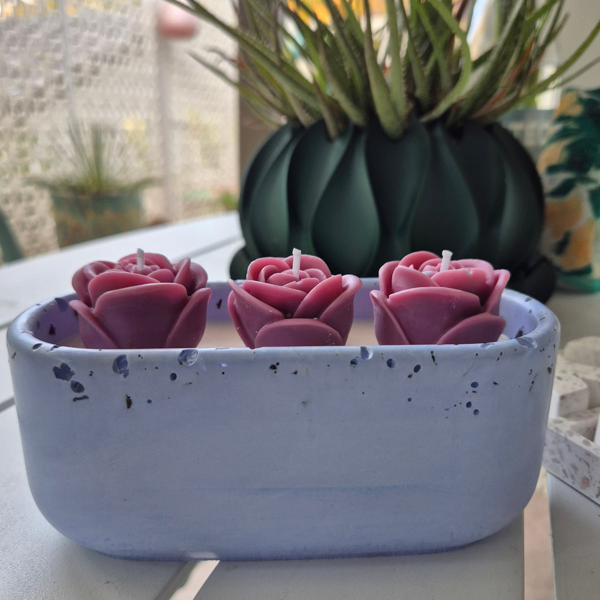 Pale blue concrete bowl candle with quartz stones and roses